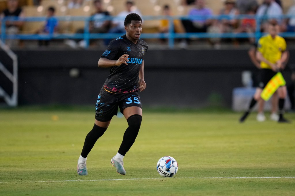 Las Vegas Lights FC midfielder Dre Fortune dribbling the ball.