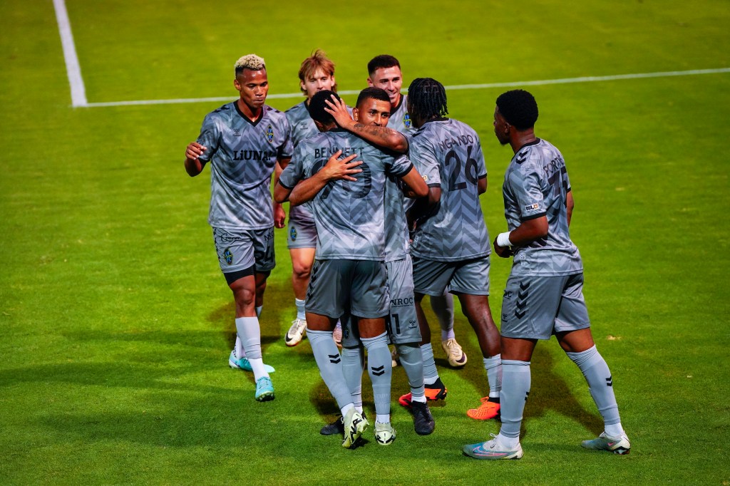 Las Vegas Lights players celebrating a goal scored by forward Khori Bennett