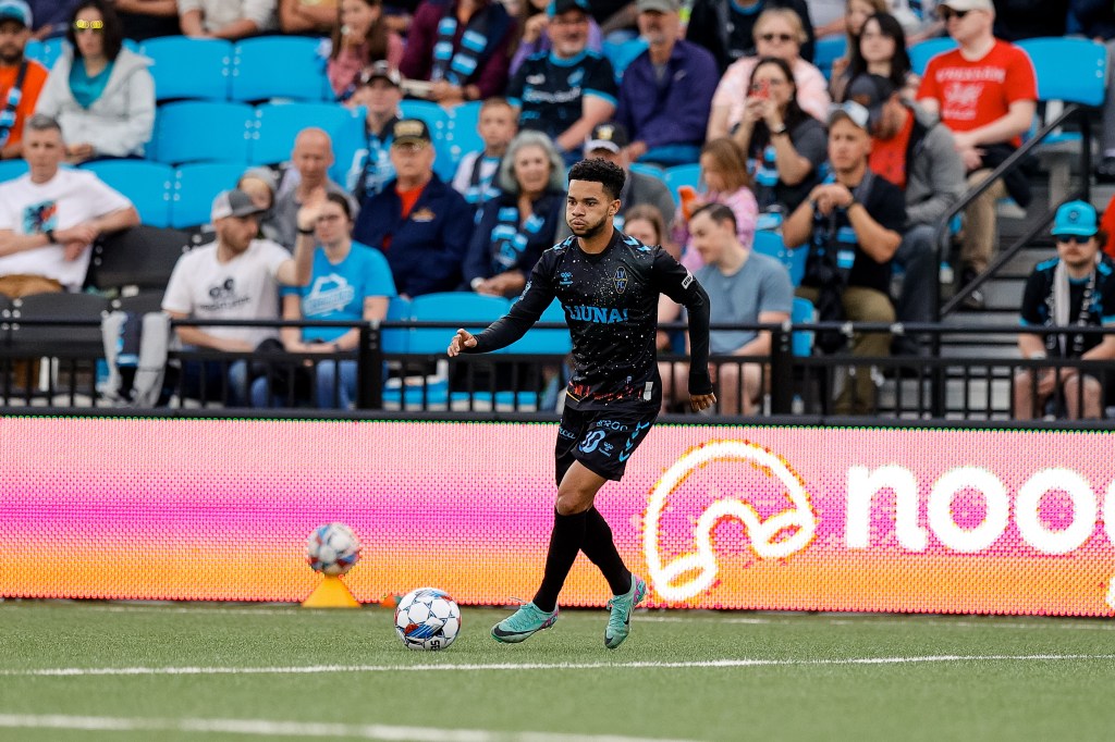 Las Vegas Lights FC defender Shawn Smart dribbling a ball