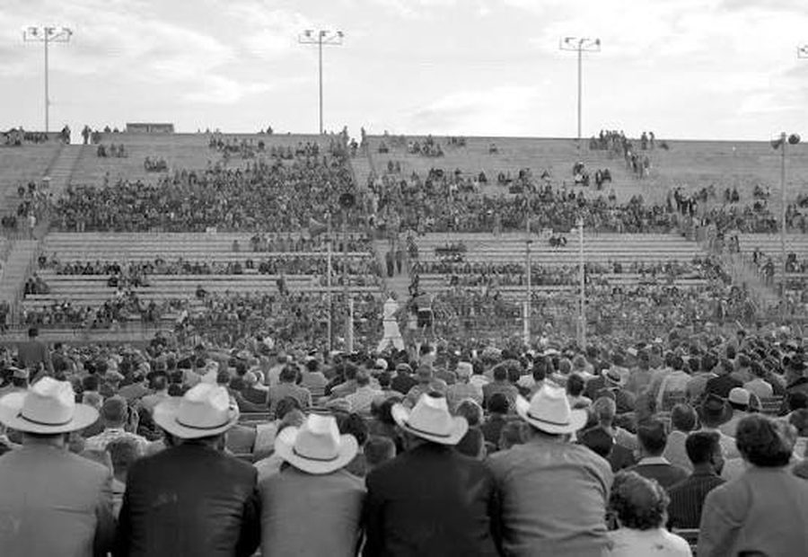A crowd in cowboy hats at a Cashman Field event