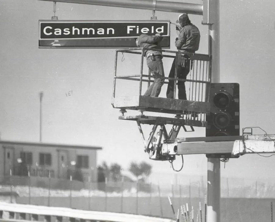 Crews installing the original Cashman Field highway sign