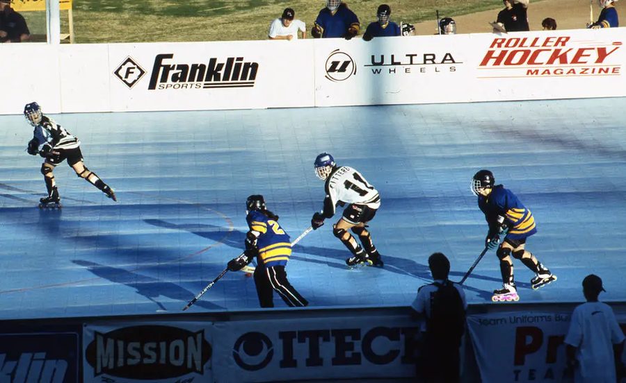 Roller hockey played on a rink set up on the Cashman infield